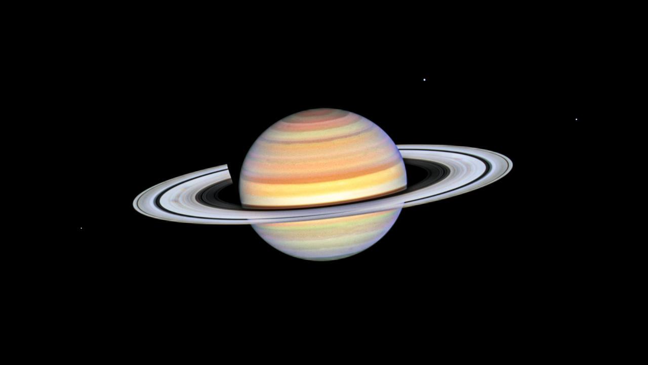 Телескоп Hubble заметил таинственные спицы в кольцах Сатурна: фото — фото